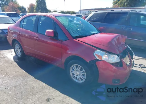 2013 Suzuki Sx4 Le/Le Popular z USA, uszkodzony, nr VIN JS2YC5A36D6100855